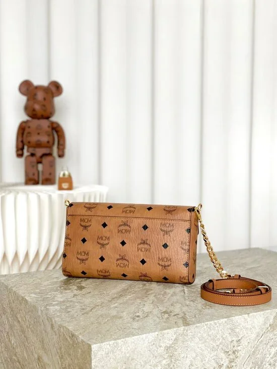 MCM Tan Monogram Clutch with Gold Accent - Picture 3 of 9